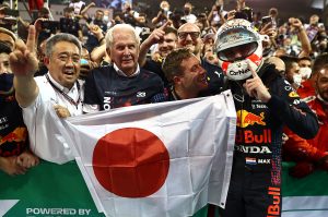 ABU DHABI, UNITED ARAB EMIRATES - DECEMBER 12: Race winner and 2021 F1 World Drivers Champion Max Verstappen of Netherlands and Red Bull Racing celebrates with Red Bull Racing Team Consultant Dr Helmut Marko and Masashi Yamamoto of Honda in parc ferme during the F1 Grand Prix of Abu Dhabi at Yas Marina Circuit on December 12, 2021 in Abu Dhabi, United Arab Emirates. (Photo by Mark Thompson/Getty Images) // Getty Images / Red Bull Content Pool  // SI202112120397 // Usage for editorial use only //
