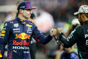ABU DHABI, UNITED ARAB EMIRATES - DECEMBER 11: Max Verstappen of Red Bull Racing and The Netherlands with Lewis Hamilton of Mercedes and Great Britain in parc ferme during qualifying ahead of the F1 Grand Prix of Abu Dhabi at Yas Marina Circuit on December 11, 2021 in Abu Dhabi, United Arab Emirates. (Photo by Peter Fox/Getty Images) // Getty Images / Red Bull Content Pool  // SI202112110245 // Usage for editorial use only //